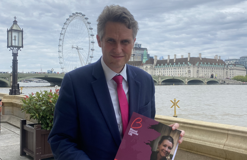 Sir Gavin poses with the new report by Blood Cancer UK on the terrace of the Palace of Westminster