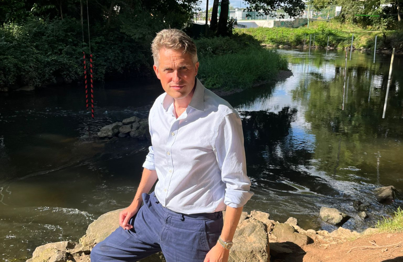 Sir Gavin Williamson stands infront of the River Trent