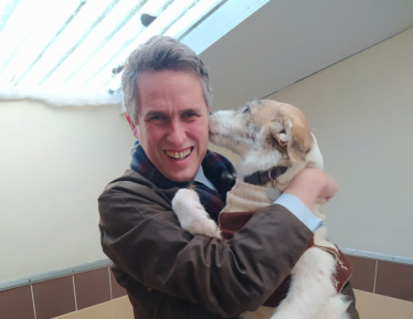 Sir Gavin Williamson is joined by one of the residents at the centre