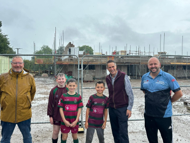 Sir Gavin Williamson is joined by the Club's chairman, Steve Lewis, and members of one of the junior teams