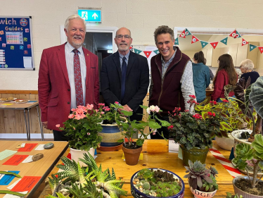 Sir Gavin Williamson is joined by participants in the Haywoods Flower and Vegetable Show